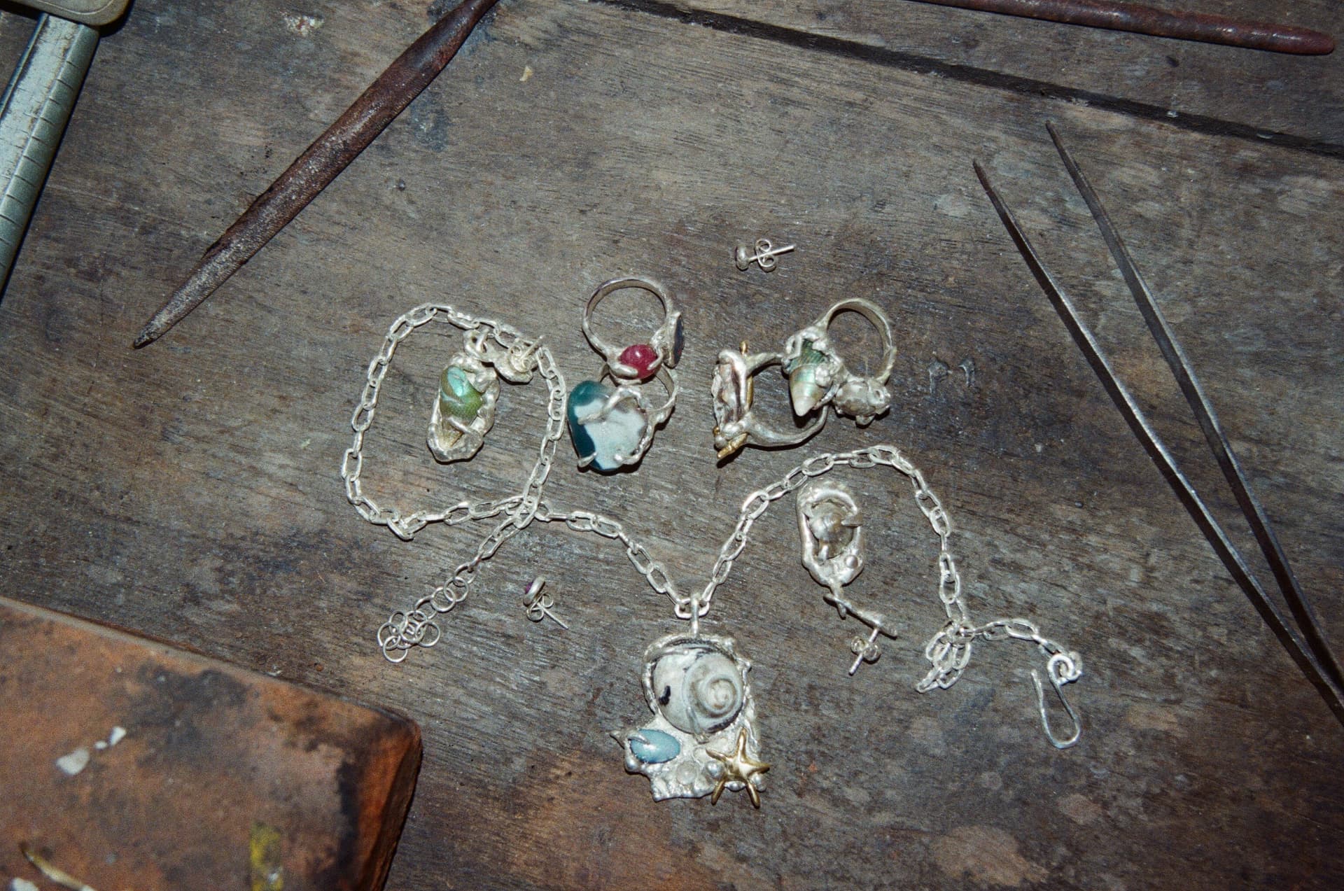 Jewellery laid out on the workbench